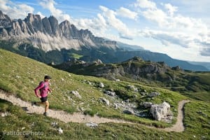 Woman trail running in the Italian Dolomites