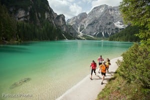Trail running along the shore of Lago di Braies