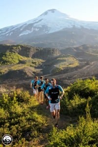 The lead pack in front of Villarrica Volcano during the early kilometers of Stage 1.