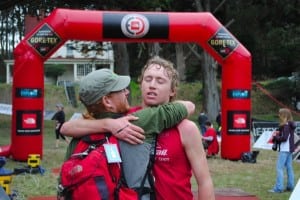 An exhausted Dakota Jones getting a hug at the end of the TNF EC Championships.
