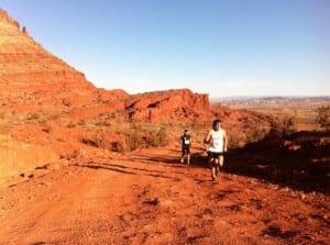 Jared Scott (right, second), Ryan Woods (hidden behind Scott, third), and Rob Krar (left, winner) taking it out hard at the 2012 Red Hot Moab 33k. Photo: iRunFar/Bryon Powell