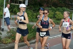Meghan Arbogast (sunglasses) running the 2011 IAU 100k World Championships.