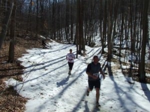 Eli and Laura Leader sprint to the finish of the New Jersey Winter Series ten miler near Morristown, New Jersey.