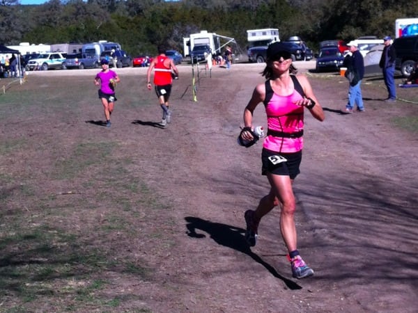 Cassie Scallon (left in lavender) chasing Liza Howard (right in pink) at the midway point of the 2012 Bandera 100k. 2012 Bandera 100k Cassie Scallon Liza Howard