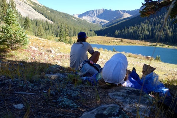 Meghan laying and eating at Cholesy Lake.