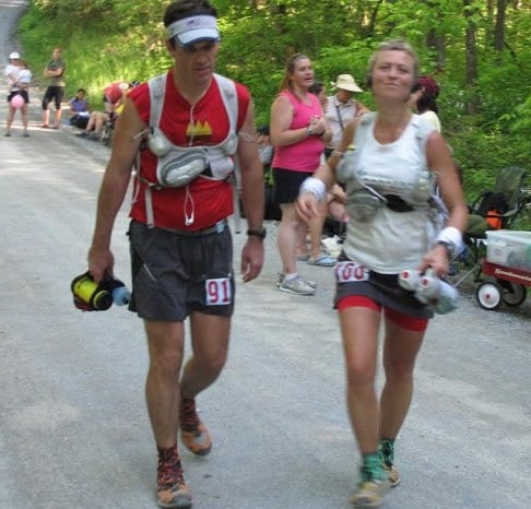 An upbeat Olga passes her husband Larry at the 2010 Mansanutten 100.