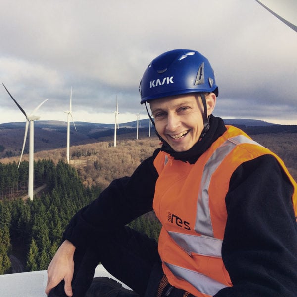 andy-symonds-sitting-on-top-of-a-wind-turbine