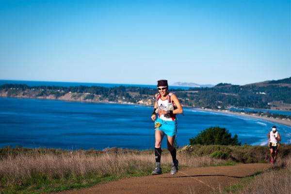 Little Miss Sunshine trying to earn her interview on the way out of Stinson Beach. Photo: Brett Rivers Ellie Greenwood 2011 TNF 50 ocean