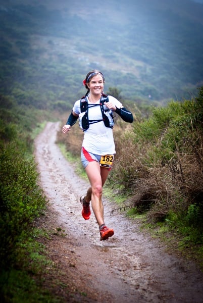 Emelie flying through the mud. Emelie Forsberg - 2012 TNF EC 50 mile - mud stride Rivers