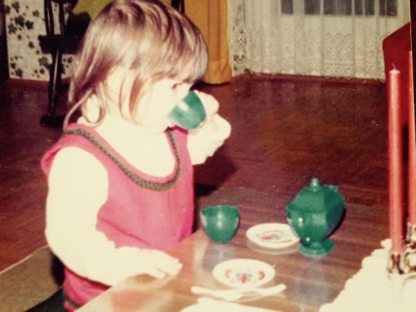 Liza Howard playing tea time as a little girl. Photo courtesy of Liza Howard.