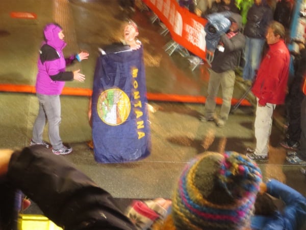 Foote celebrating with the Montana flag after taking third at the 2012 TNF UTMB. Mike Foote - Montana Flag - TNF UTMB 2012