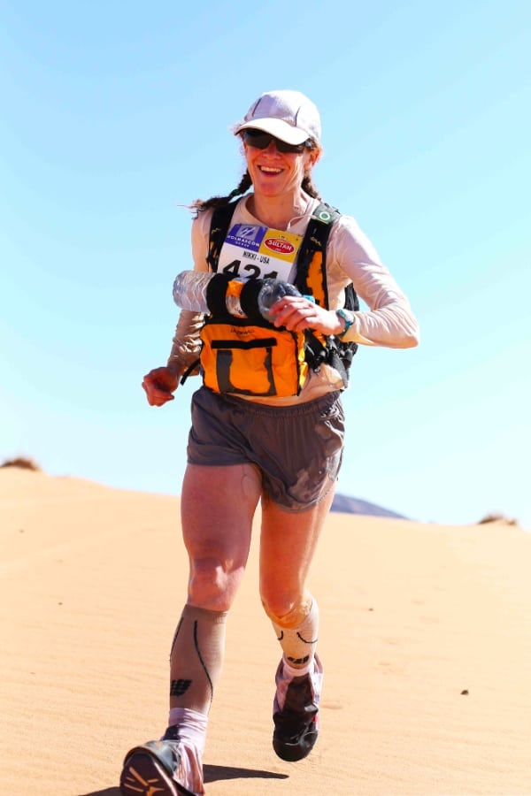 Nikki Kimball looking pretty happy during the very challenging 2014 Marathon des Sables. Photo: Kirsten Kortebein