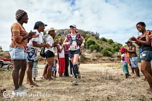 The author runs through a crowd of local ladies. Meghan Hicks - Trail de Rodrigues - crowd ladies